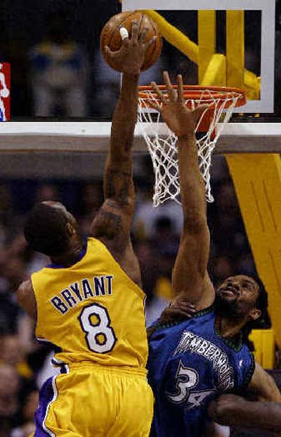 
L.A.'s Kobe Bryant dunks over Michael Olowokandi of Minnesota. L.A.'s Kobe Bryant dunks over Michael Olowokandi of Minnesota. 
 (Associated PressAssociated Press / The Spokesman-Review)