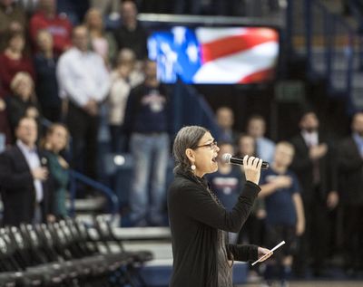 Native American LaRae Wiley sings the National Anthem in Salish before the start of the Gonzaga-Bryant game, Nov. 18, 2016, in the McCarthey Athletic Center. (Dan Pelle / The Spokesman-Review)