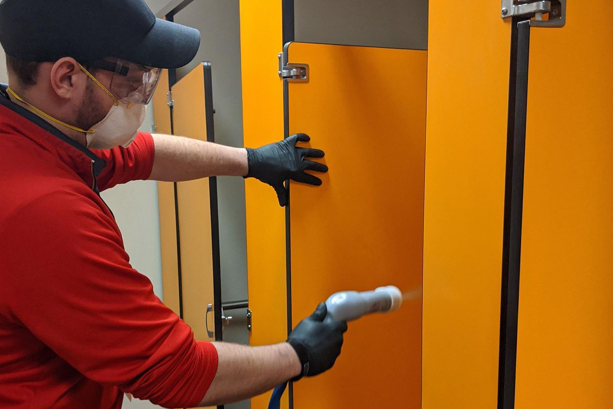 A custodial staff member from Spokane Public Schools disinfects the bathrooms at Bemiss Elementary School. (Spokane Public Schools / Courtesy)