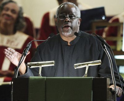 The Rev. Ronald E. Braxton delivers his sermon at Metropolitan AME Church Sunday in Washington, D.C. Churches in the nation’s capital have started extending invitations to President-elect Barack Obama and his family, touting their African-American roots and their ties to presidents past.  (Associated Press / The Spokesman-Review)