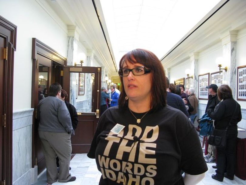 Lisa Perry of Boise expresses her disappointment after the Senate State Affairs Committee refused to introduce legislation Friday to ban housing and employment discrimination on the basis of sexual orientation. (Betsy Russell)