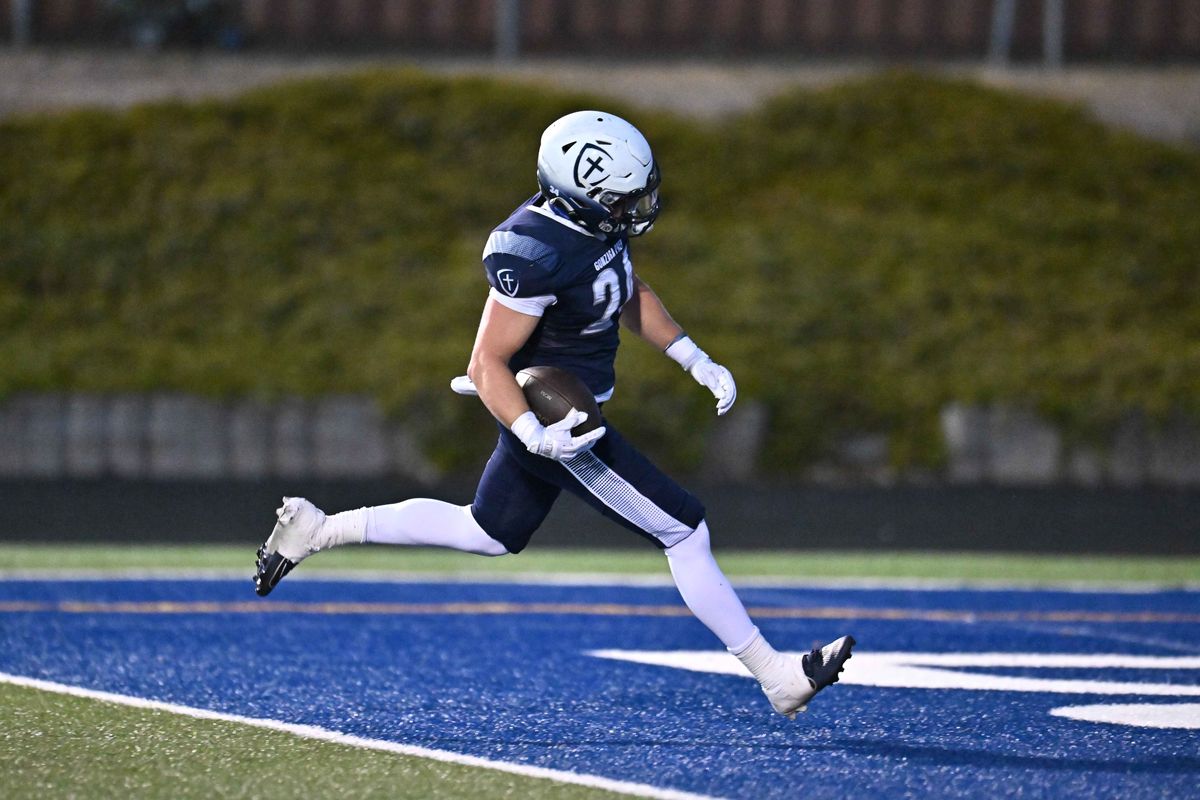 Gonzaga Prep’s Jimmy Grainger runs for a touchdown against Mt. Spokane on Friday at Bullpup Stadium. (James Snook/For The Spokesman-Review)