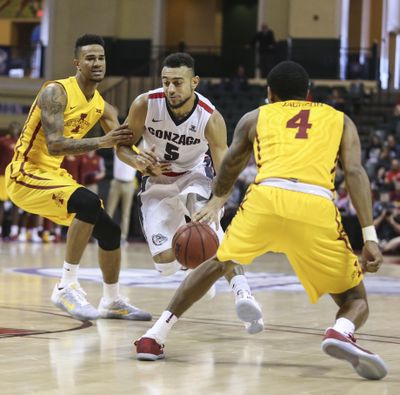 Gonzaga guard Nigel Williams-Goss, who scored a team-high 18 points Sunday, dribbles between Iowa State guards Nazareth Mitrou-Long, left and Donovan Jackson during the second half. (Willie J. Allen Jr. / AP)