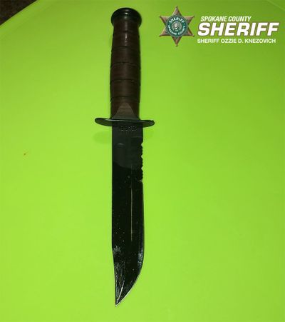 Devin Dewmer, 22, of Spokane Valley, is accused of stabbing his aunt in the chest with this KA-BAR knife during an argument over child care arrangements on Thursday, July 2, 2020. He faces a charge of first-degree assault.  (Emma Epperly / The Spokesman-Review)