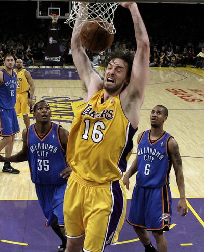 Lakers forward Pau Gasol dunks for two of his 25 points Tuesday.  (Associated Press)