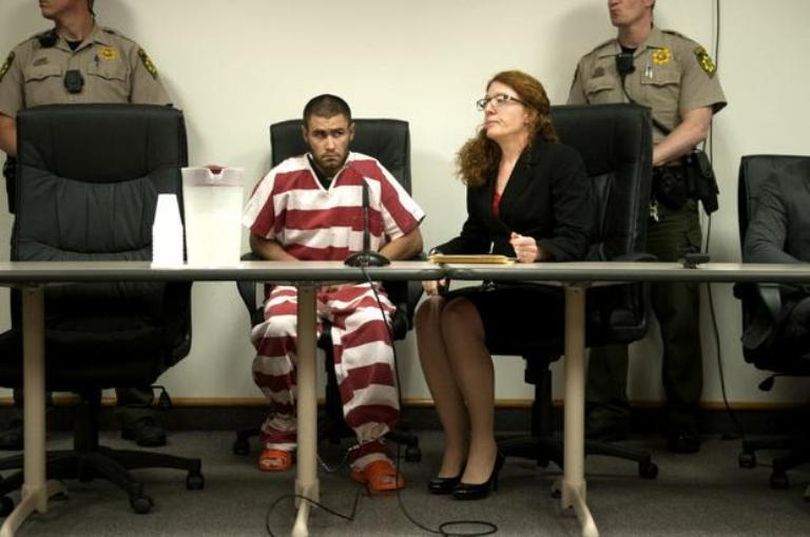 Court-appointed public defender Mayli Walsh sits next to Jonathan Daniel Renfro, who is charged with first-degree murder in the May 5 shooting of Coeur d’Alene Police Sgt. Greg Moore. (SR photo: Kathy Plonka)
