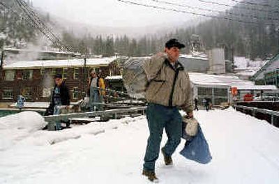 
Workers leave the Sunshine Mine after working their final shift before the facility's closure near Kellogg, Idaho, on Feb. 16, 2001. After two decades of decline, the U.S. mining industry is losing engineers needed to build tunnels, shafts and drifts. Since the 1980s, several schools that offered mining engineering courses have either closed, merged with other engineering disciplines, or changed focus, such as cleaning the damage from old mines. 
 (Associated Press / The Spokesman-Review)