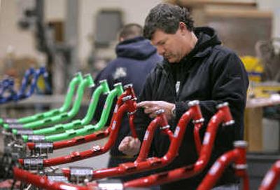
Steve McElvain works on a push scooter at Patmont Motor Werks in Minden, Nev.
 (The Spokesman-Review)