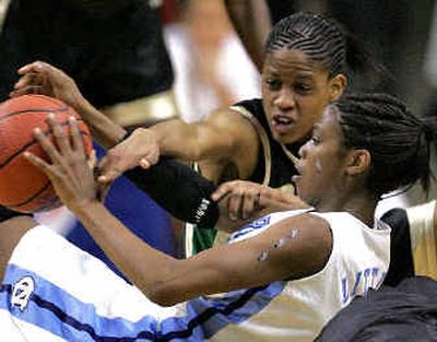 
North Carolina's Camille Little, front, battles Baylor's Latoya Wyatt for the loose ball during the first half Monday.
 (Associated Press / The Spokesman-Review)