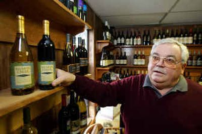 
Fred Franzia, CEO of Bronco Wine Co., holds a bottle of his new Salmon Creek wine at company headquarters in Ceres, Calif.
 (Associated Press / The Spokesman-Review)