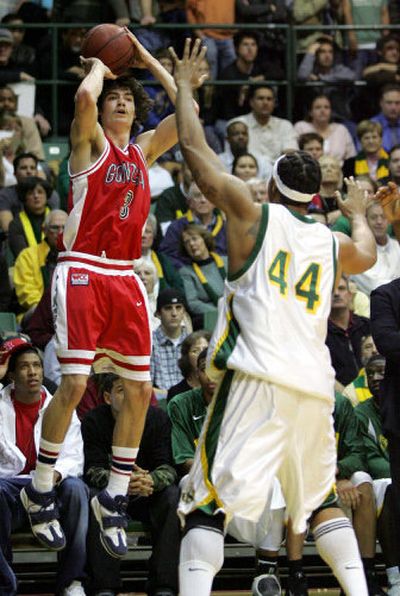 Gonzaga forward Adam Morrison fires off a 3-pointer in front of San Francisco's Jason Wallace-Carter. 
 (Associated Press / The Spokesman-Review)