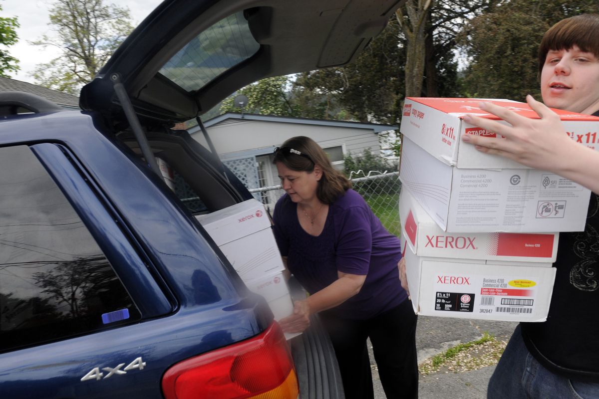 bartr@spokesman.com Jesse Sheldon and his mother Julie unload  clothing she picked up from the Chester Elementary PTA, which collected the items for Inland NW Baby. (J. BART RAYNIAK)