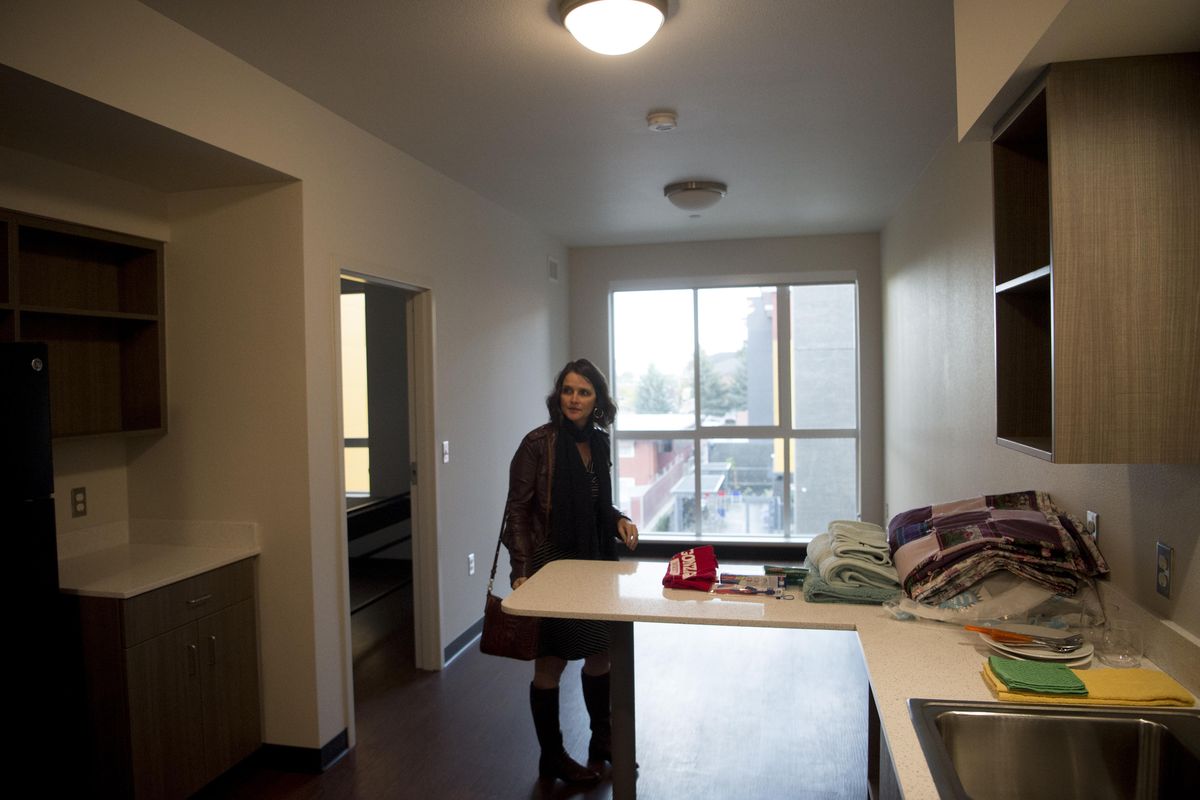Ann Marie Byrd, development director for Catholic Charities, stands in a new apartment on Wednesday, Oct. 5, 2016, at Buder Haven apartments in Spokane, Wash. Buder Haven is one of six different housing projects costing roughly $60 million in total that were built with the goal of eliminating homelessness by 2020. (Tyler Tjomsland / The Spokesman-Review)