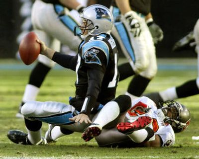 
The Bucs' Ronde Barber sacks Panthers QB Jake Delhomme.
 (Associated Press / The Spokesman-Review)
