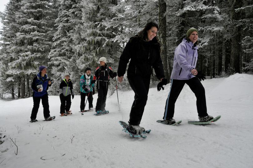 Women and girls head out on the trails at Mount Spokane during the 10th annual Women's Souper Bowl snowshoe trek on Feb. 1, 2015. (Rich Landers)