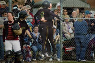 Shadle Park's Kinzee Powell (6) gets a hug from teammate Stephanie McVay after they both hit home runs in the fifth inning of the Highlanders' 7-0 win over University on Tuesday.
 (Christopher Anderson/ / The Spokesman-Review)