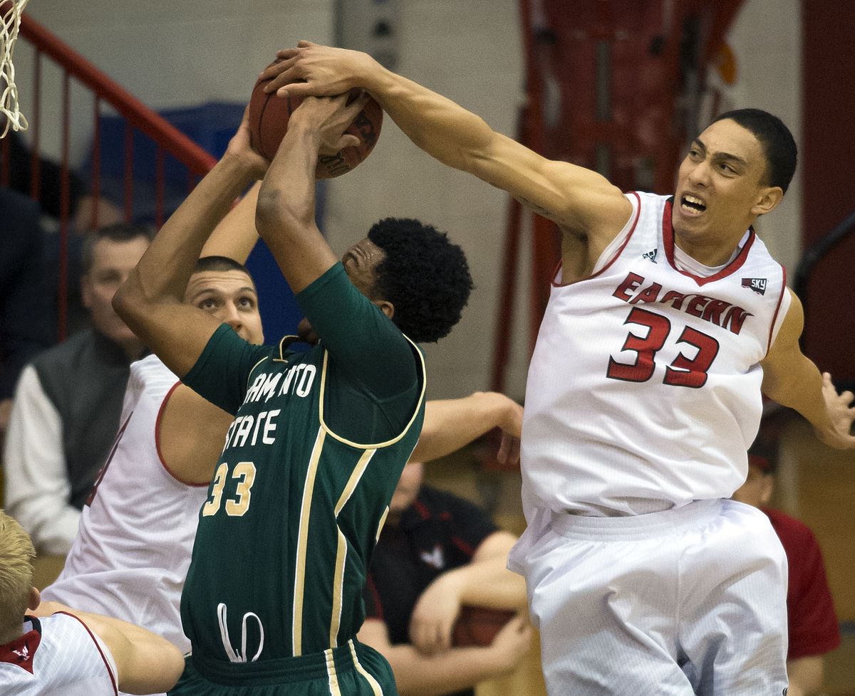 Eastern Washington forward Garrett Moon blocks a shot by Sacramento State’s Nick Hornsby during the first half of Thursday’s Big Sky showdown for first place. (Colin Mulvany)