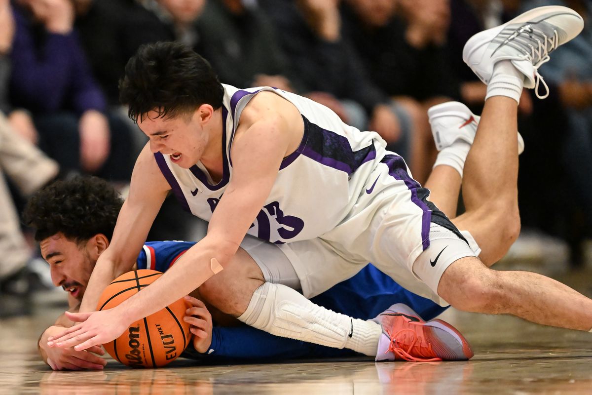 Portland Pilots guard Joel Foxwell (23) dives for a loose ball against Gonzaga Bulldogs guard Braeden Smith (3) during the second half of a college basketball game on Wednesday, Feb 4, 2026, at Chiles Center in Portland, Ore. Portland won the game 87-80.  (Tyler Tjomsland/The Spokesman-Review)