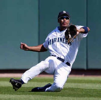 
Mariners center fielder Randy Winn makes a sliding catch for an out. 
 (Associated Press / The Spokesman-Review)