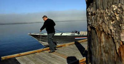 
Bryan Mitchell, of Rathdrum,  brings in his boat in at Boothe's Park boat launch in Coeur d'Alene on Thursday. Mitchell has an annual pass for Kootenai County boat launches.
 (Kathy Plonka / The Spokesman-Review)