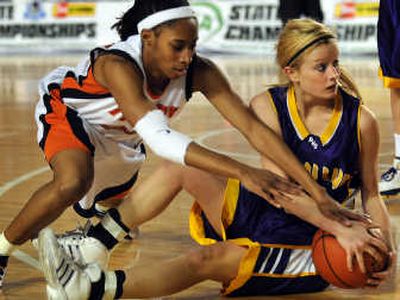 
Lewis and Clark senior Brittany Kennedy, left, battles Puyallup's Lauren Picha for possession of the ball during Wednesday's State 4A opener at the Tacoma Dome. 
 (Rajah Bose / The Spokesman-Review)