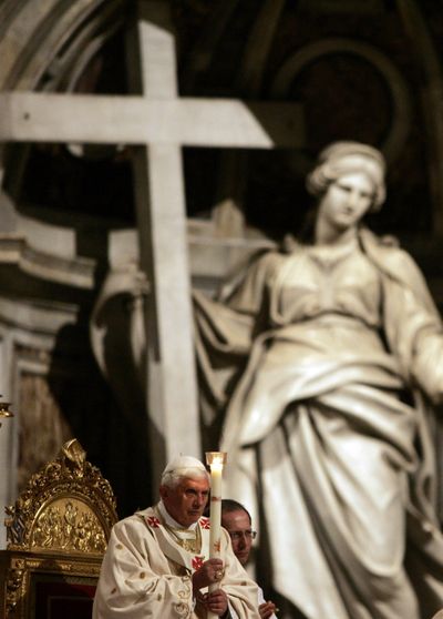 Pope Benedict XVI holds a candle during the Easter vigil Mass in St. Peter’s Basilica at the Vatican on Saturday.  (Associated Press / The Spokesman-Review)
