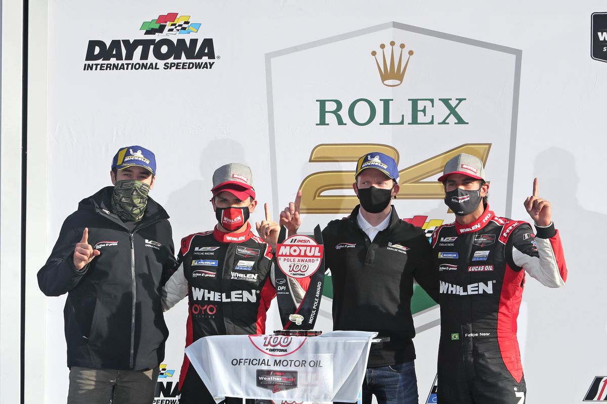 Chase Elliot, left, Pipo Derani, Mike Conway and Felipe Nasr celebrate in Victory Lane on Sunday after winning a qualifying race for the Rolex 24 hour auto race at Daytona International Speedway in Daytona Beach, Fla.  (David Graham)
