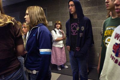 
Central Valley High School freshman Brittany Annett, center in white, is led through her schedule with classmates Thursday during the first day of class. Freshmen were introduced to the school before upper classmen started their classes later in the day. 
 (Brian Plonka / The Spokesman-Review)