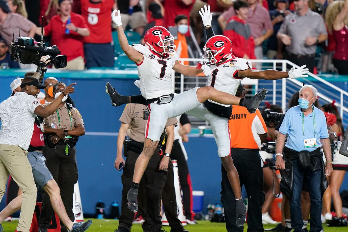 Georgia wide receiver Jermaine Burton celebrates after scoring with wide receiver George Pickens against Michigan during the first half of the Orange Bowl NCAA College Football Playoff semifinal game, Friday, Dec. 31, 2021, in Miami Gardens, Fla.  (Lynne Sladky)