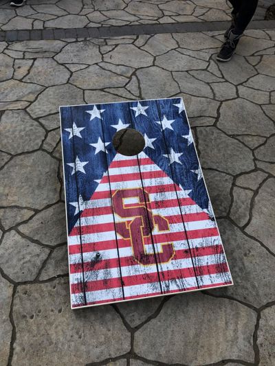 Erica Demateis played corn hole with neighbors on Tuesday – all while maintaining proper social distancing. . (Courtesy)