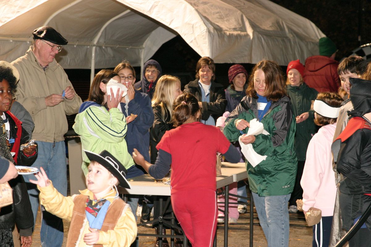 Visitors play games and eat dinner and candy at the Light the Night party at the church in 2005. (Photo courtesy of the Lake City Assembly of God / The Spokesman-Review)
