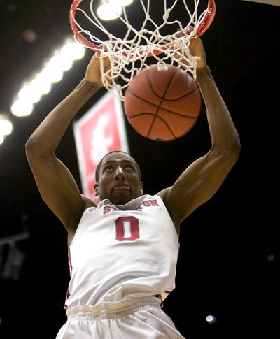 Washington State guard Marcus Capers slams home a second-half shot.  (Associated Press)