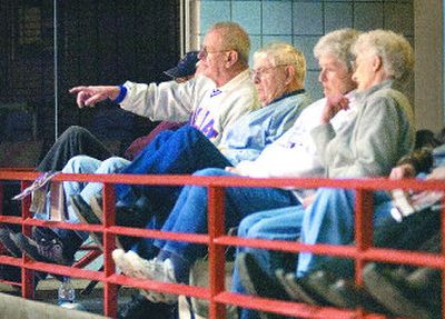 
Tom Peterson points out strategy as the Willapa Valley boys team falls behind early during its 2B state  tournament game against Mt. Vernon Christian on Thursday in the Spokane Arena. Sitting with him are Gene Clements, Alice Clements and Jeannette Bridges. They sit high in the arena where the folding seats are more comfortable and there is more room. 
 (CHRISTOPHER ANDERSON / The Spokesman-Review)