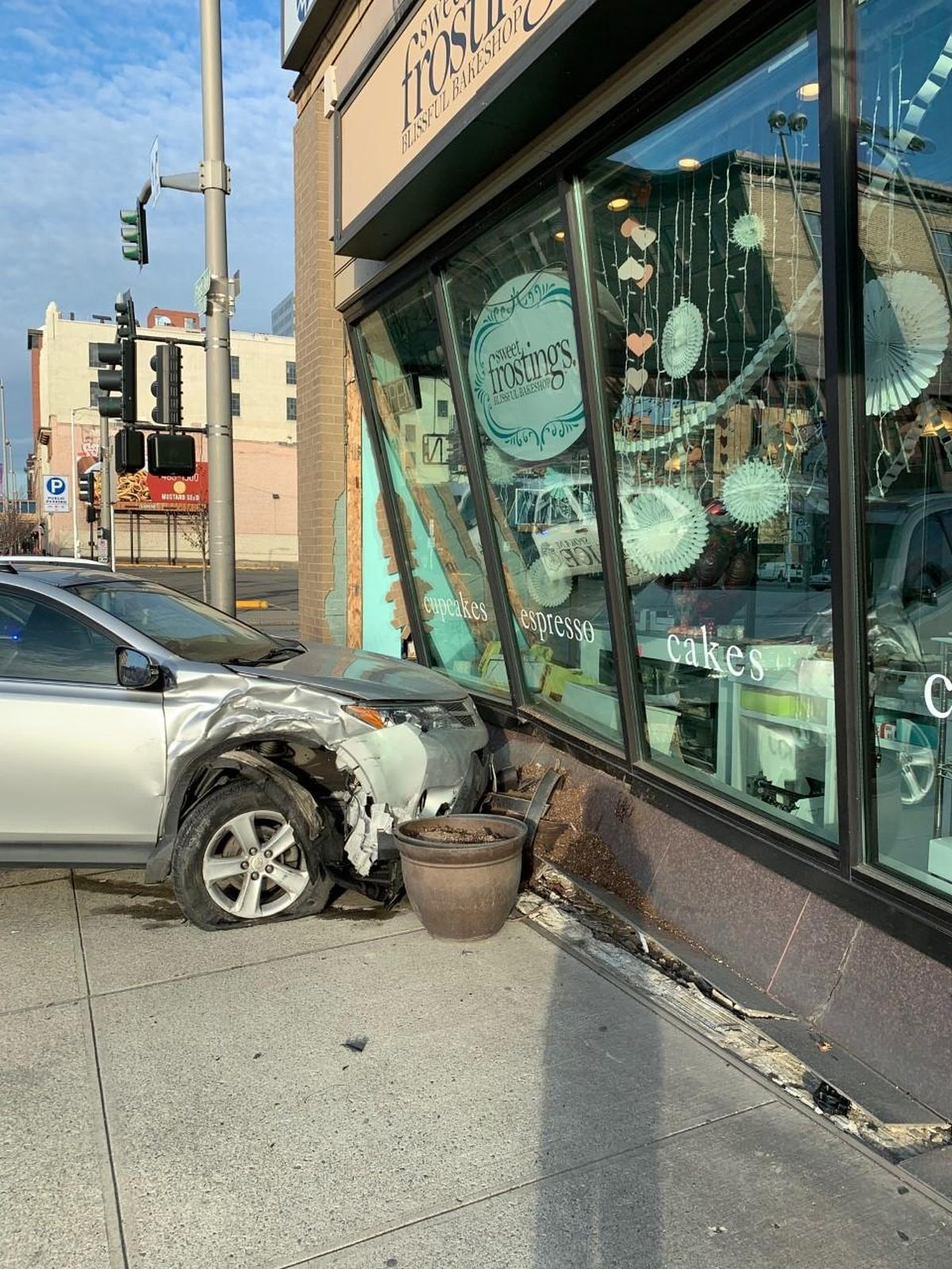 A car struck Sweet Frostings Blissful Bakeshop in downtown Spokane on Saturday, Feb. 22, 2020. No serious injuries were reported. (Courtesy photo / Jessica Winfrey)