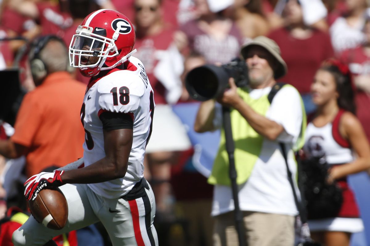 Georgia cornerback Deandre Baker (18) returns an interception for a touchdown during the first half of an NCAA college football game against South Carolina, Saturday, Sept. 8, 2018, in Columbia, S.C. (Joshua L. Jones / AP)