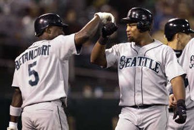 
Seattle's Adrian Beltre, right, is congratulated by teammate Yuniesky Betancourt after hitting a two-run home run against Oakland. Associated Press
 (Associated Press / The Spokesman-Review)