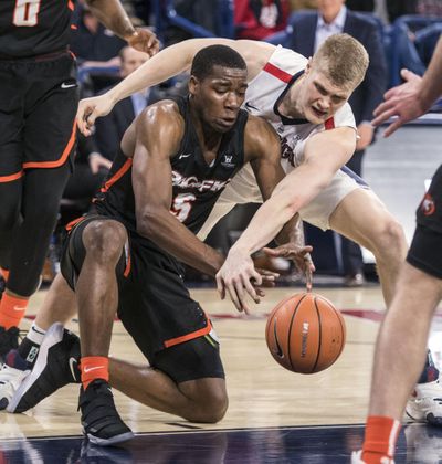 Gonzaga center Jacob Larsen slaps the ball away from Pacific forward Anthony Townes, Thursday, Dec. 28, 2017, in the McCarthey Athletic Center. (Dan Pelle / The Spokesman-Review)