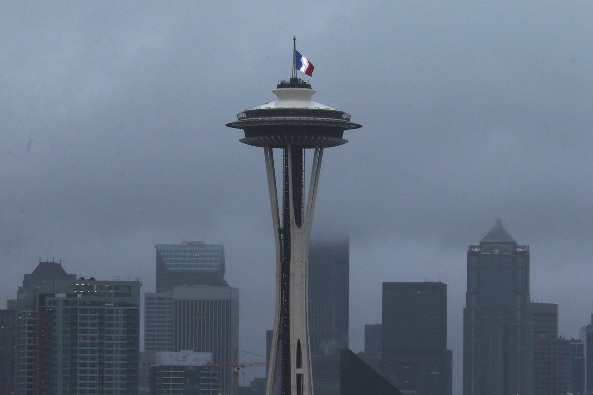 The French flag is flown atop of the Space Needle in Seattle on Saturday, Nov. 14, 2015. Multiple attacks across Paris on Friday night have left scores dead and hundreds injured. (Sy Bean / The Seattle Times)