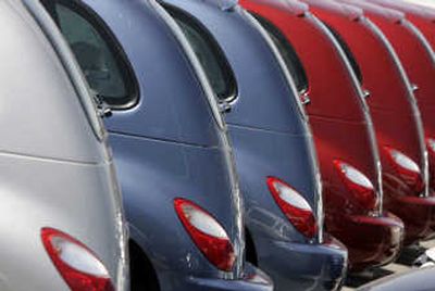 
A long row of unsold 2007 PT Cruisers sits outside a Chrysler-Jeep agency in the east Denver suburb of Aurora, Colo.  Associated Press
 (Associated Press / The Spokesman-Review)