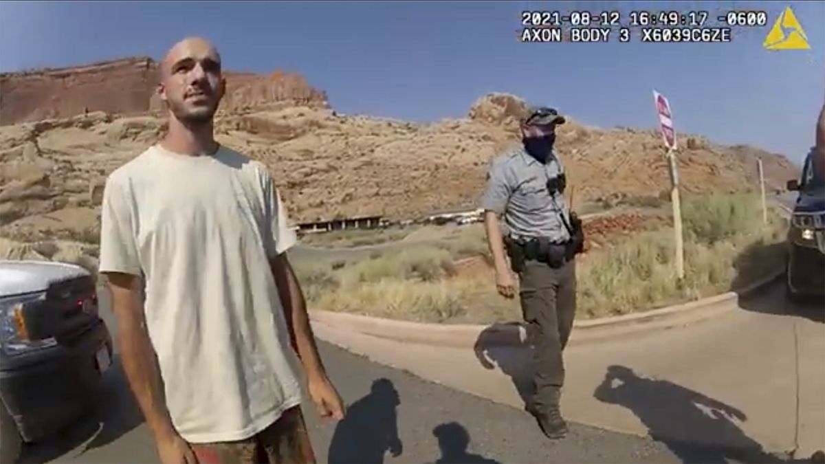 This Aug. 12, 2021, photo from video provided by the Moab, Utah, Police Department shows Brian Laundrie talking to a police officer after police pulled over the van he was traveling in with his girlfriend, Gabrielle "Gabby" Petito, near the entrance to Arches National Park in Utah. Laundrie, the boyfriend of slain cross-country traveler Gabby Petito, took responsibility for killing her in a notebook discovered near his body in a Florida swamp, the FBI announced Friday, Jan. 21, 2022.  (HOGP)