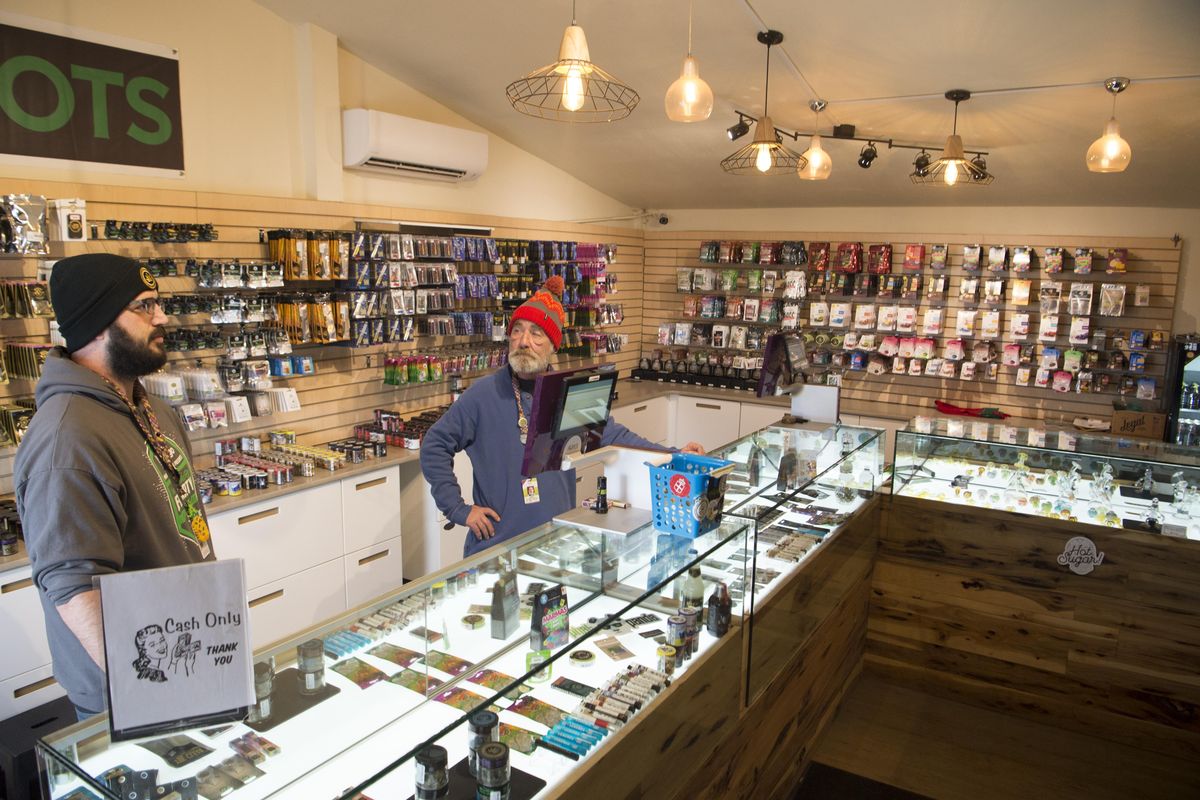 At the Green2Go cannabis shop at the Tokio exit of I-90 near Ritzville, Washington, Caleb Tolman, left, and Steve Gaulke, right, wait for customers in the small shop Thursday, Jan. 4, 2017. (SR)