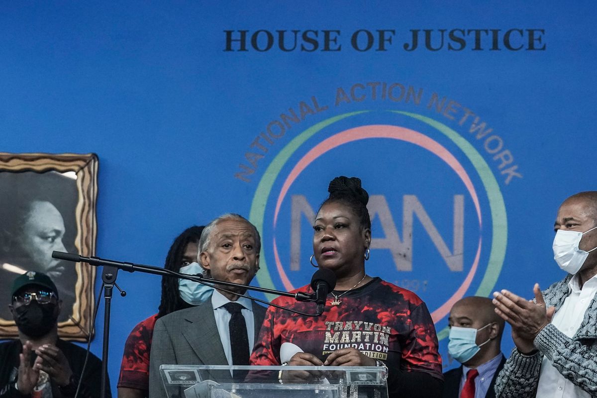 Rev. Al Sharpton, third from left, president of the National Action Network (NAN), and Mayor Eric Adams, far right, stand next to Sybrina Fulton, center, the mother of Trayvon Martin, as she address a rally commemorating the 10th anniversary of her son
