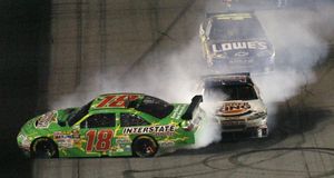 Kyle Busch spins as he is hit by Tony Stewart near finish line last week at Daytona.  (Associated Press / The Spokesman-Review)