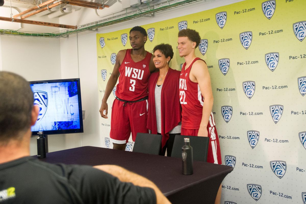 WSU basketball's Malachi Flynn (22) and Robert Franks (3) take a group photo with WSU alumna and Pac-12 Network reporter and analyst Cindy Brunson during Pac-12 Men's Basketball Media Day on Thursday, October 12, 2017, at the Pac-12's headquarters in San Francisco, Calif. (Tyler Tjomsland / The Spokesman-Review)