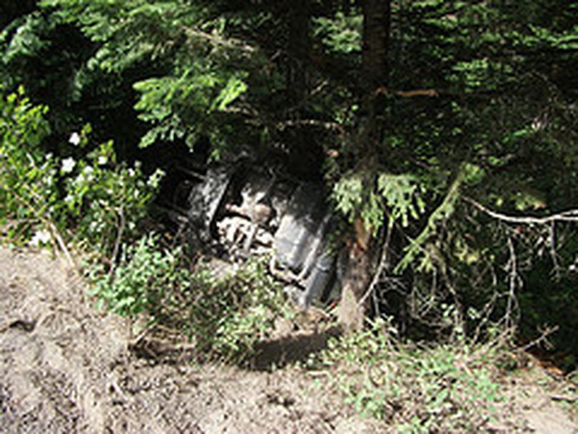 This jeep ended up upside down on a steep slope below West Newman Lake Drive on Aug. 10. Crews from Newman Lake Fire District and the Spokane Valley Fire Department responded to free the woman trapped inside.  (Photo courtesy the Spokane Valley Fire Department)