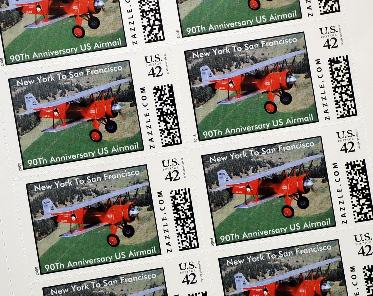 Stamps with a picture of Larry Tobin’s 1927 Stearman C3B will be on letters carried on the re-enactment fight from New York to San Francisco.  (Dan Pelle / The Spokesman-Review)