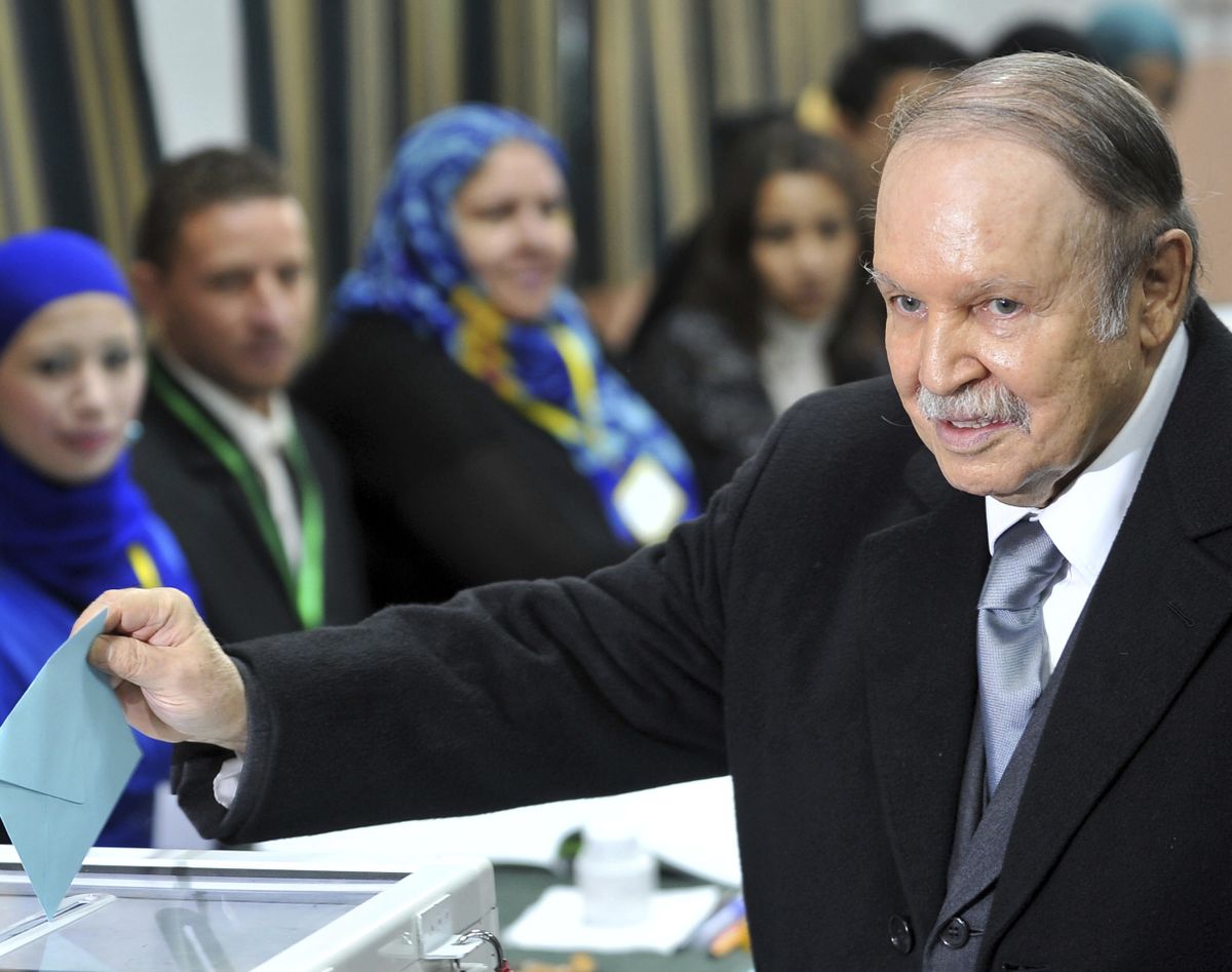 In this Thursday, Nov. 29, 2012 photo, Algerian President Abdelaziz Bouteflika casts his ballot for local elections in Algiers. Former Algerian President Bouteflika, who fought for independence from France in the 1950s and 1960s and was ousted amid pro-democracy protests in 2019 after 20 years in power, has died at age 84, state television announced Friday, Sept. 17, 2021.  (Anis Belghoul)