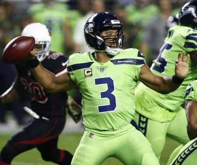 Seattle Seahawks quarterback Russell Wilson (3) throws against the Arizona Cardinals prior to an NFL football game, Thursday, Nov. 9, 2017, in Glendale, Ariz. (Ross D. Franklin / Associated Press)