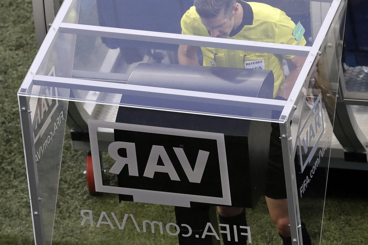 Referee Matt Conger from New Zealand watches the Video Assistant Referee system, known as VAR during the Group D match between Nigeria and Iceland at the 2018 soccer World Cup in the Volgograd Arena in Volgograd, Russia, Friday, June 22, 2018. (Themba Hadebe / Associated Press)