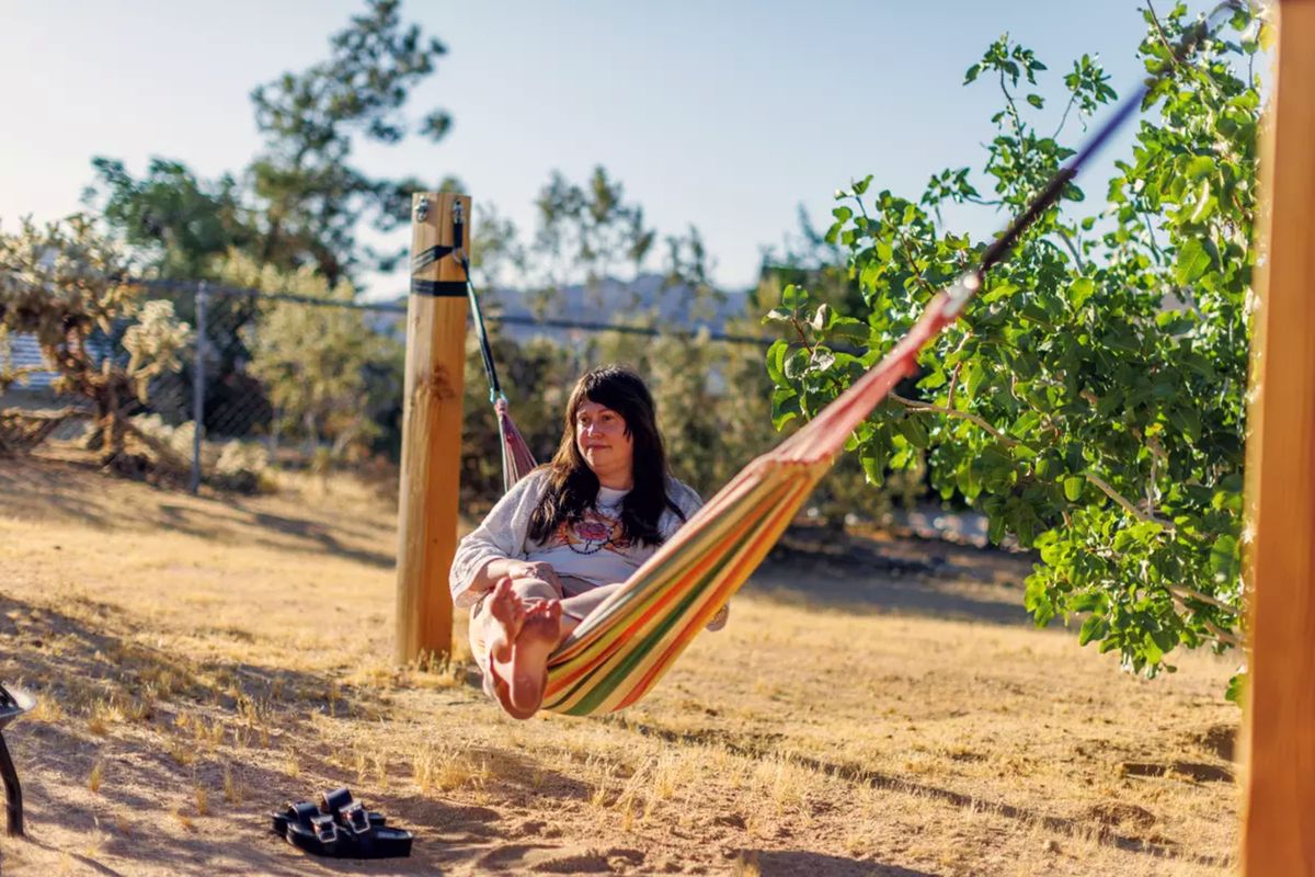 Author and screenwriter Jennifer Brody enjoys her backyard hammock amongst the desert landscape in Joshua Tree.   (Gina Ferazzi/Los Angeles Times/TNS)